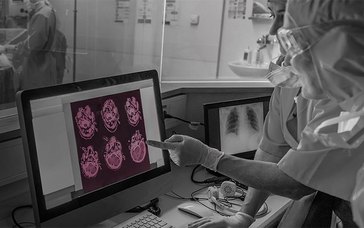 Healthcare workers looking at scans